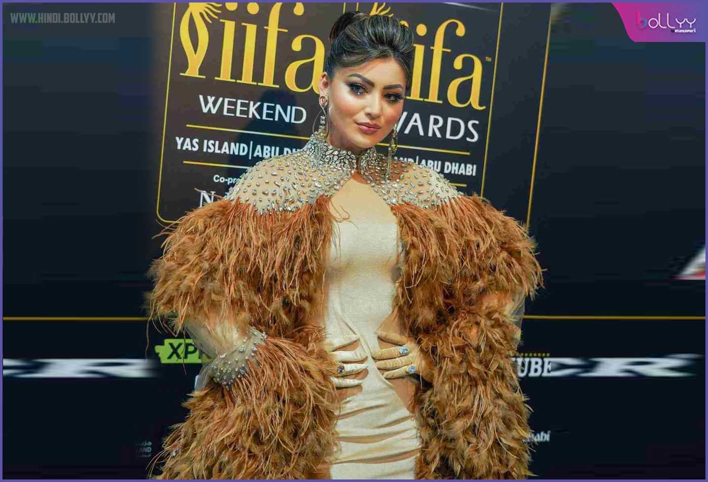 Urvashi Rautela: Carried the brown feather look from Cannes to IIFA